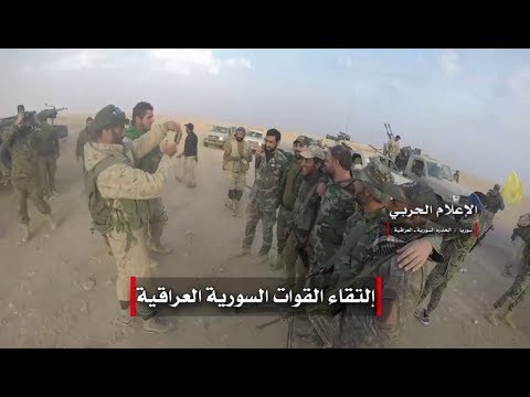 First seen footage of government troops meeting Iraqi military at border post