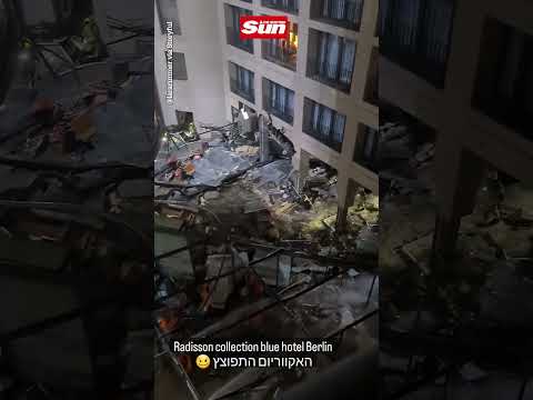 Giant glass aquarium explodes at Berlin Hotel injuring two in destroyed lobby